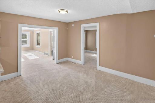 Off the dining room, you'll find a main floor bedroom.