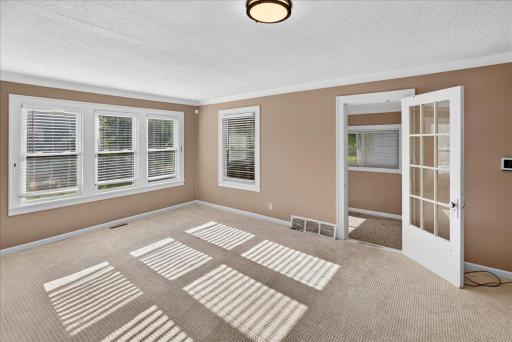 From the living room step into a bonus room great for a small office or storage.