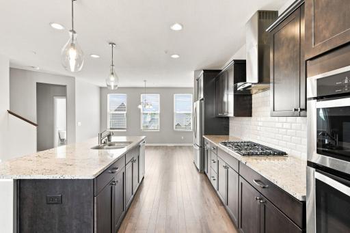 5140 Hampton St NE -separate pendant lighting and recessed lighting provides as little or as much light as you desire in the kitchen