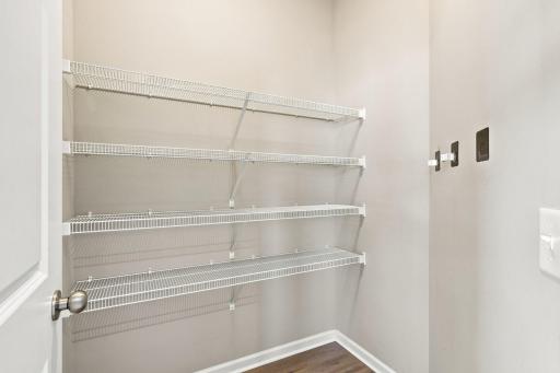 5140 Hampton St NE - This large pantry/closet is located right off of the kitchen and is a game changer, adding valuable storage space for food, small appliances, brooms, vacuum, etc.