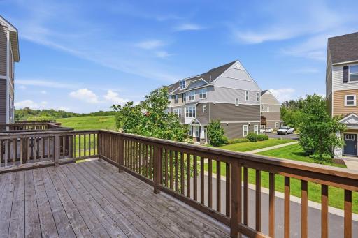5140 Hampton St NE - The spacious east-facing balcony has room for multiple pieces of furniture, as well as a grill, plants, etc., and offers a shady spot to relax in the afternoons/evenings.