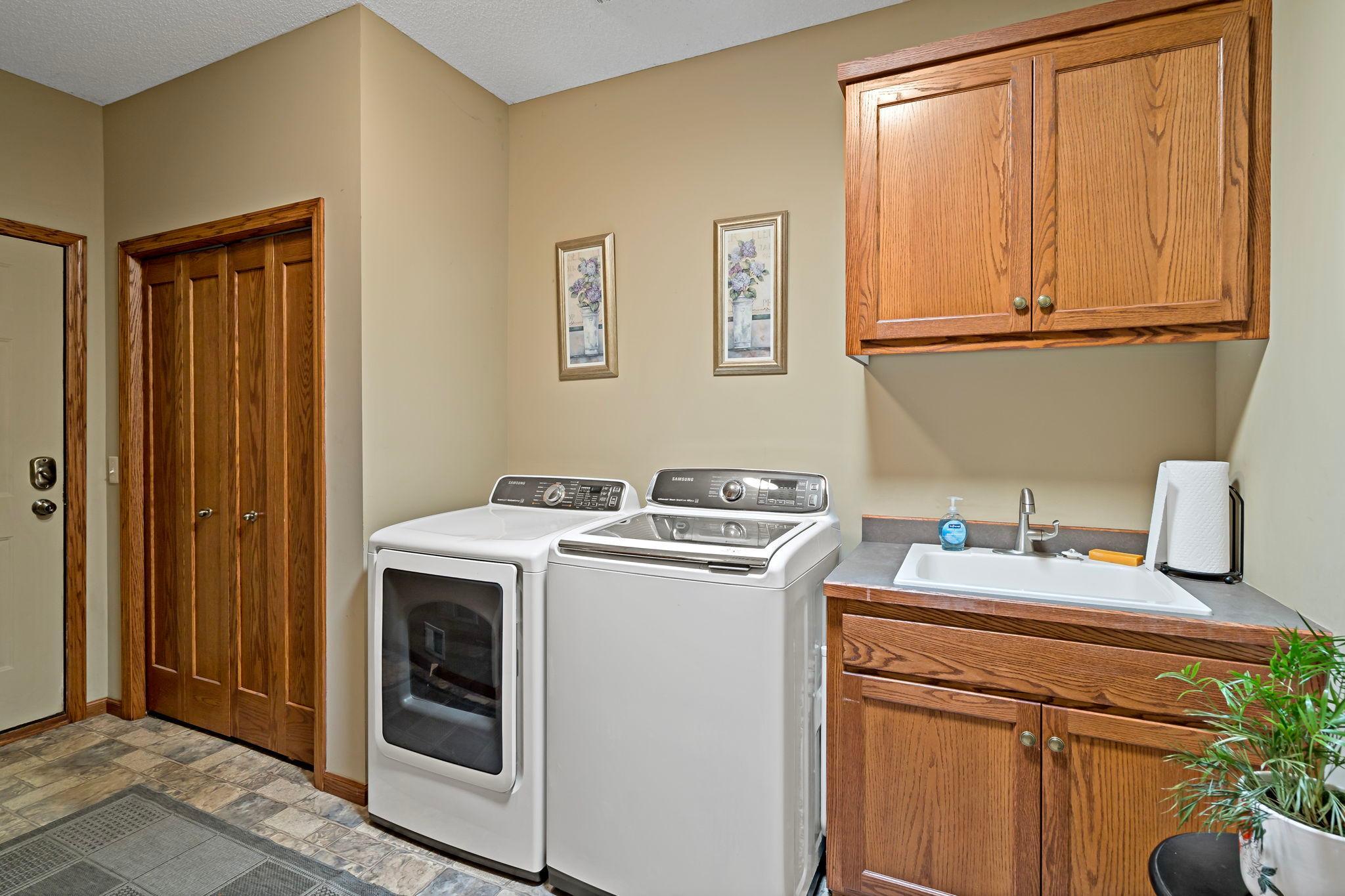 laundry, gas dryer, sink and folding counter
