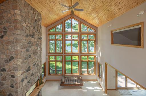 Enjoy the views of Woman Lake from the towering great room windows