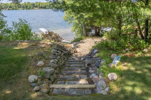 Stone steps to stone patio at waters edge
