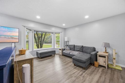 Living room with large bay window for all that natural lighting.