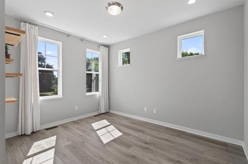 Main level bonus room has tons of natural light flowing through!