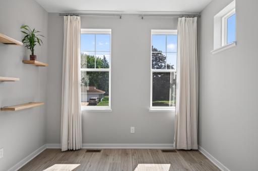 Main level bonus room has tons of natural light flowing through!