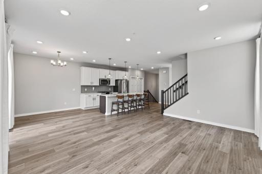 Living room, dining room, and kitchen areas