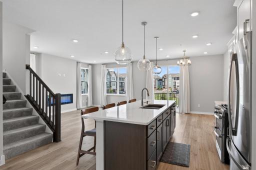 Kitchen area with views of the living and dining room areas