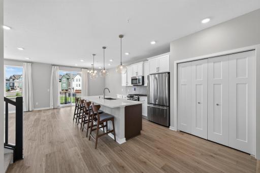 Kitchen area with views of the living and dining room areas