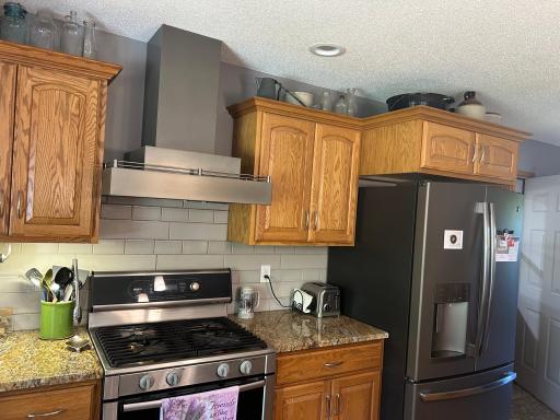 Gas stove with hood fan