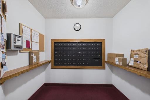 Mail room. Common spaces include community room, outdoor patio, library/game room, and workshop area.