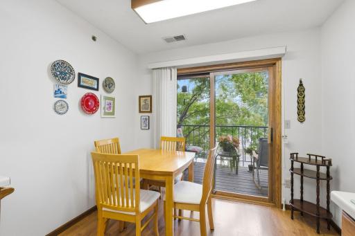 Breakfast nook looks out onto balcony.