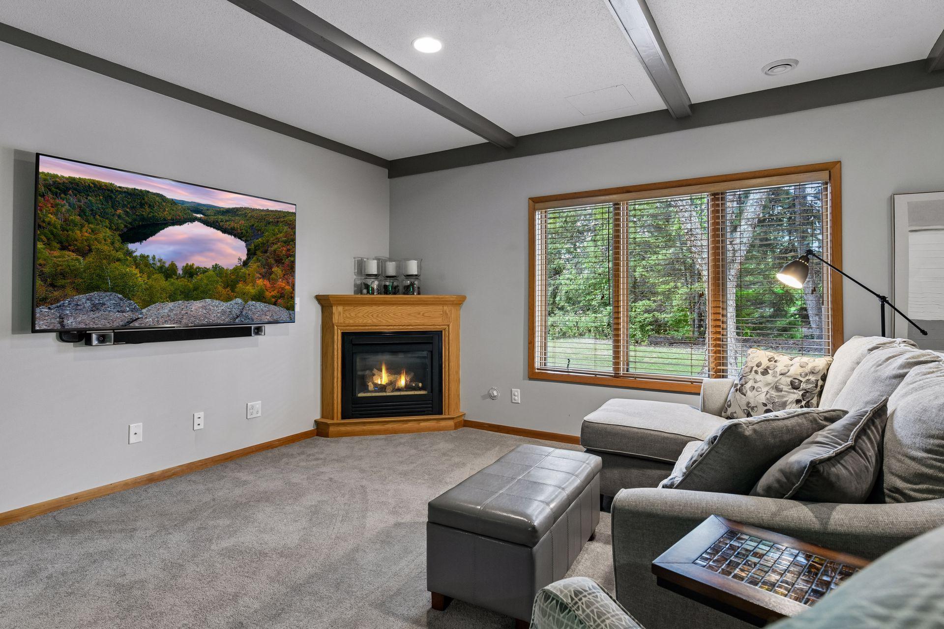 A spacious family room with a second gas fireplace, billiards area, versatile flex or exercise room, two additional bedrooms and a full bathroom make this level ideal for guests and gatherings.