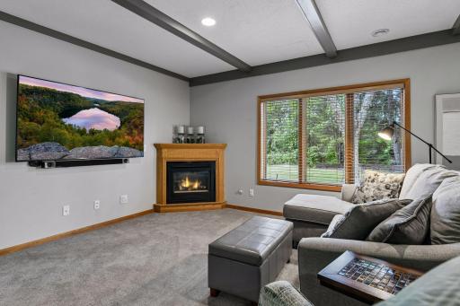 A spacious family room with a second gas fireplace, billiards area, versatile flex or exercise room, two additional bedrooms and a full bathroom make this level ideal for guests and gatherings.