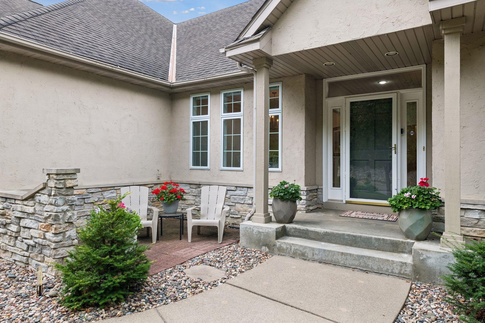 The finished two-car garage features durable epoxy flooring. Outdoors, the beautifully maintained front and backyard are complemented by low-maintenance irrigated gardens that provide lovely seasonal color.