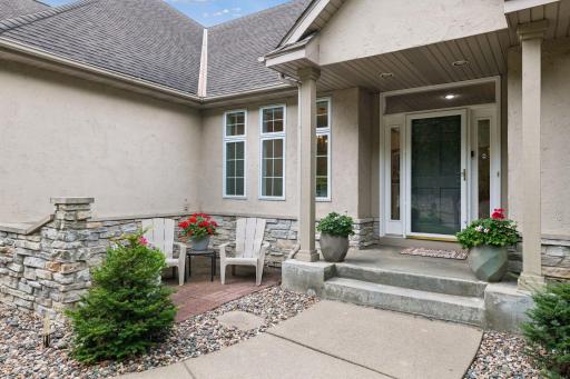 The finished two-car garage features durable epoxy flooring. Outdoors, the beautifully maintained front and backyard are complemented by low-maintenance irrigated gardens that provide lovely seasonal color.