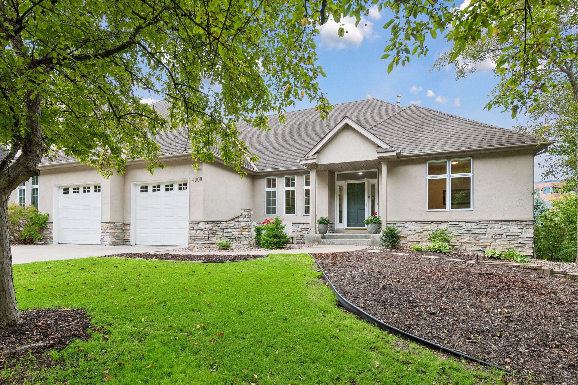Ideally situated in a desirable Edina location with convenient access to exceptional dining, shopping and recreation, 4908 Malibu Drive offers a rare combination of space, privacy, comfort and low-maintenance living—without HOA fees.
