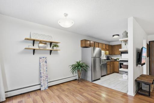 Engineered flooring; only ground floor units allow it throughout the condo. Upper floor units are carpeted except kitchen and baths. Updated lighting and cabinet knobs.