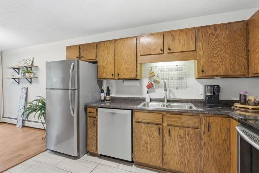 Kitchen/dining area opens to balcony/deck.