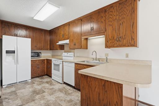 From pancake breakfasts and after-school snacks to holiday baking and dinners with friends, this kitchen is ready for memories to be made! Abundant cabinetry, generous counter space, and breakfast-bar seating make everyday life that much easier.