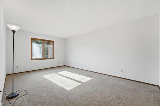 Your own peaceful retreat at the end of the day! This spacious primary bedroom offers plenty of room to unwind, curl up with a good book, and create a comfortable space that truly feels like your own.
