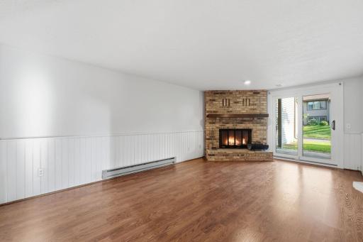 Bring on the movie marathons, game days, and cozy nights by the fire! The brick fireplace adds warmth and character, while the walkout makes this a fantastic space for entertaining indoors and out.