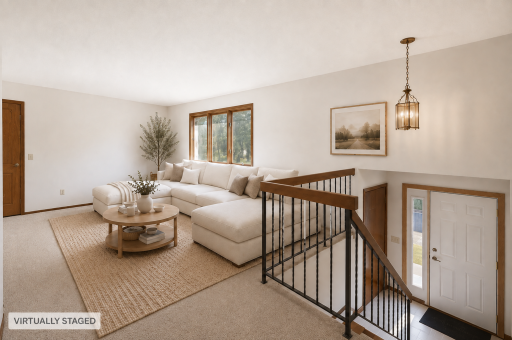 A warm welcome home! The spacious living area sits just off the entry, creating an inviting place to kick off your shoes, get comfortable, and reconnect at the end of the day.