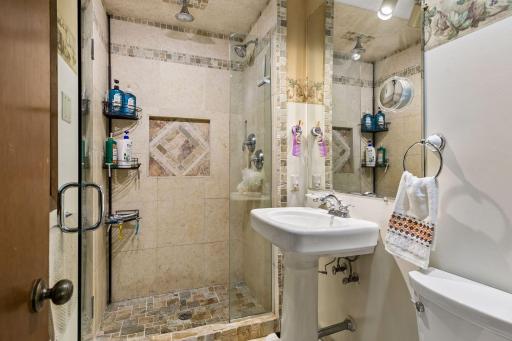 Primary bathroom with luxurious walk-in shower and in-floor heat