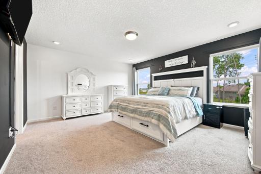 Primary Bedroom with ensuite bathroom and large walk-in closet