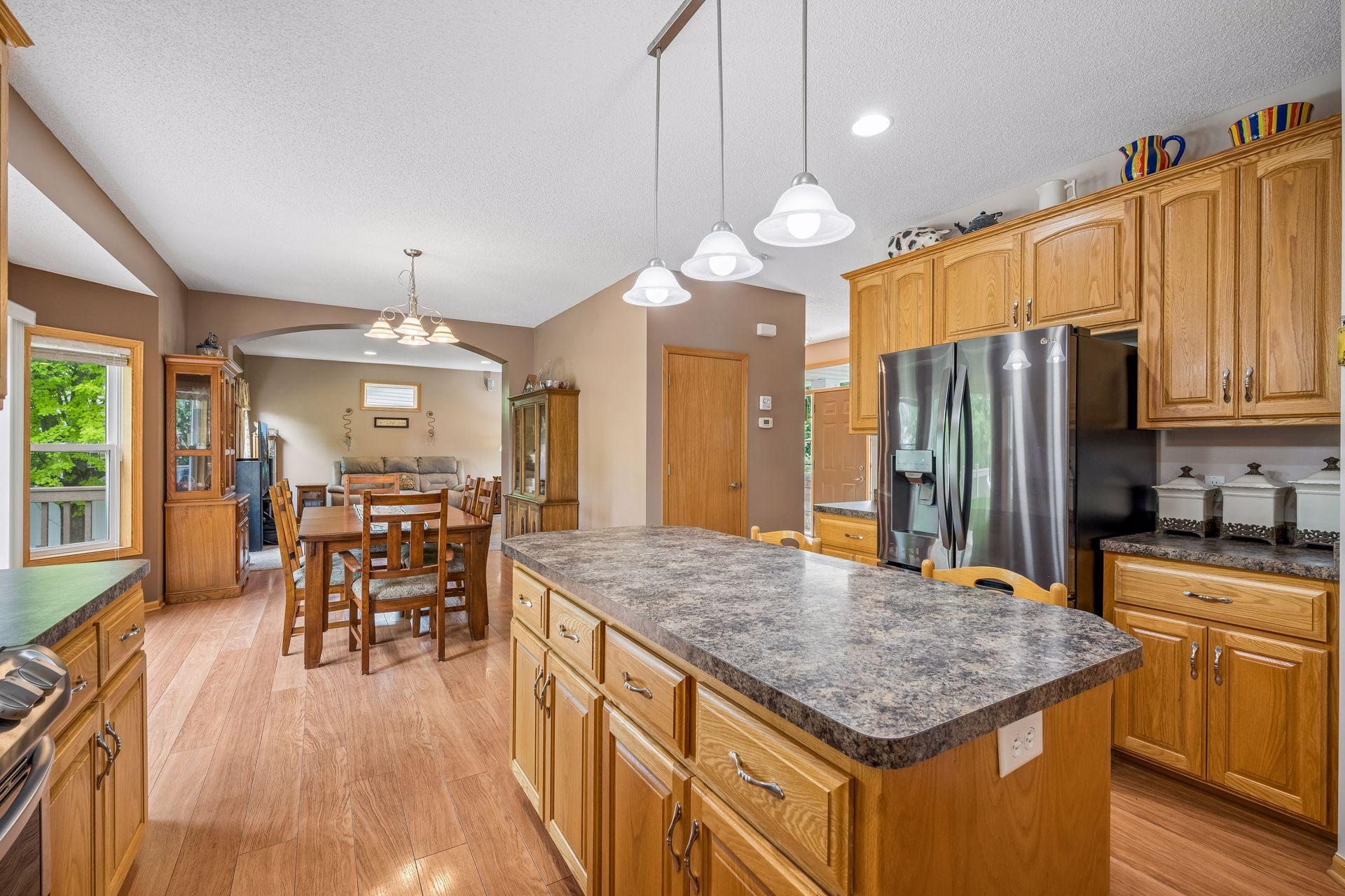 Kitchen, Center Island, & Laminate Hardwood Floors