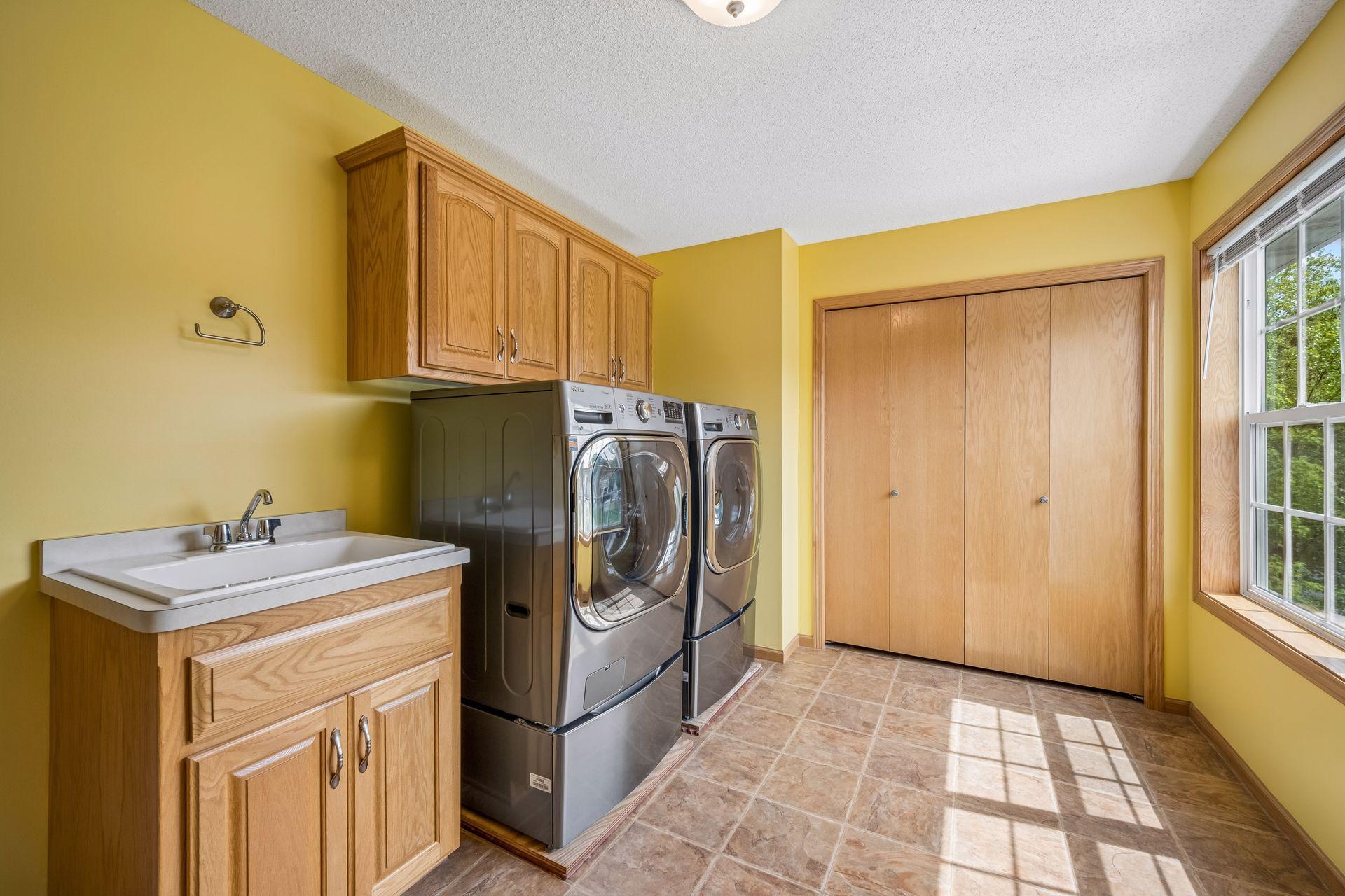 Upper Laundry with sink and closet