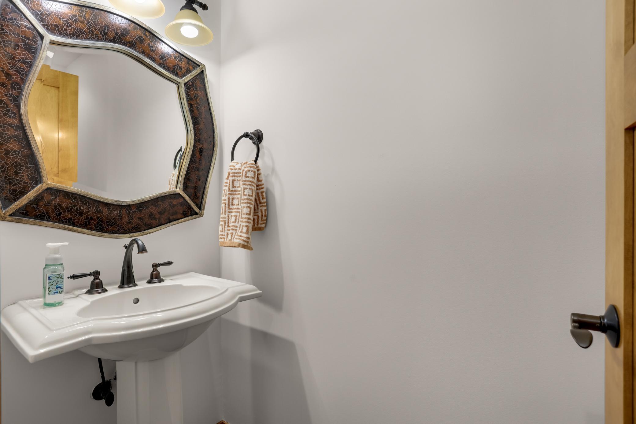 Convenient main-level half bath, perfectly situated