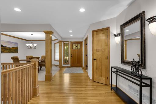 Massive, grand entryway welcomes you with beautiful hardwood floors, with an elegant dinning room perfectly positioned to the side- creating an impressive first impression from the moment you arrive