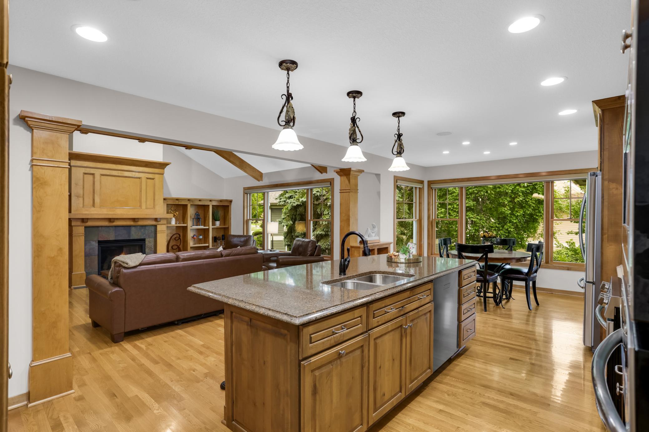 Stunning full view of the kitchen flowing seamlessly into the open-concept living room—what a wonderful floor plan.