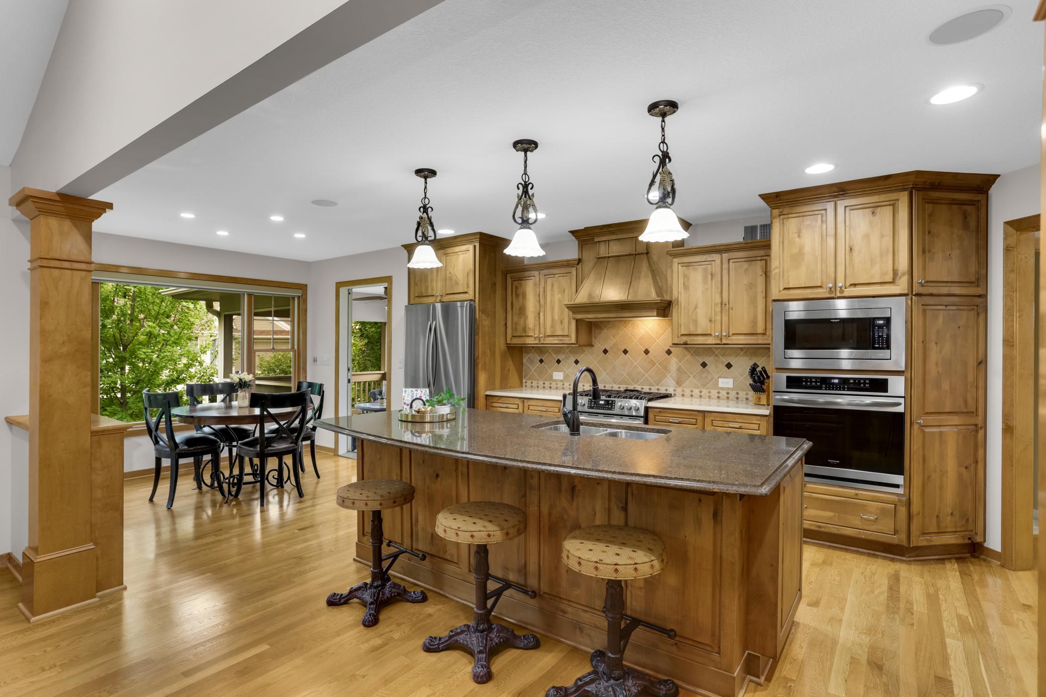 A stunning kitchen designed for gathering, featuring a spacious eat-in area, ample seating at the Cambria island, and an ideal layout with plenty of room to cook and entertain.
