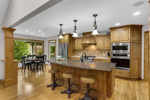 A stunning kitchen designed for gathering, featuring a spacious eat-in area, ample seating at the Cambria island, and an ideal layout with plenty of room to cook and entertain.