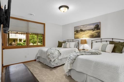 Oversized lower-level bedroom with plenty of room for two beds, offering exceptional flexibility. Note: All closets throughout the home are walk-ins, providing abundant storage.