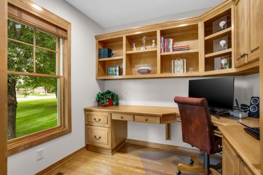 Office with custom cabinetry, including a built-in file cabinet, and wonderful natural sunlight.