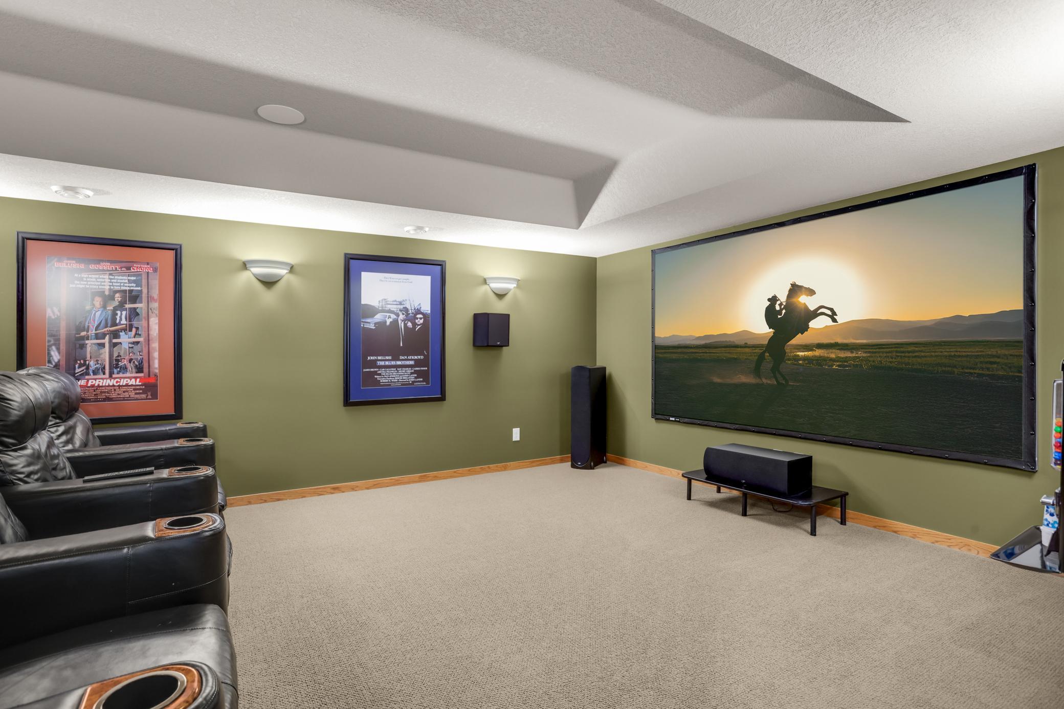 The private theater room offers eight luxury leather recliner seats and an impressive 119-inch screen, creating the ultimate movie and gaming experience