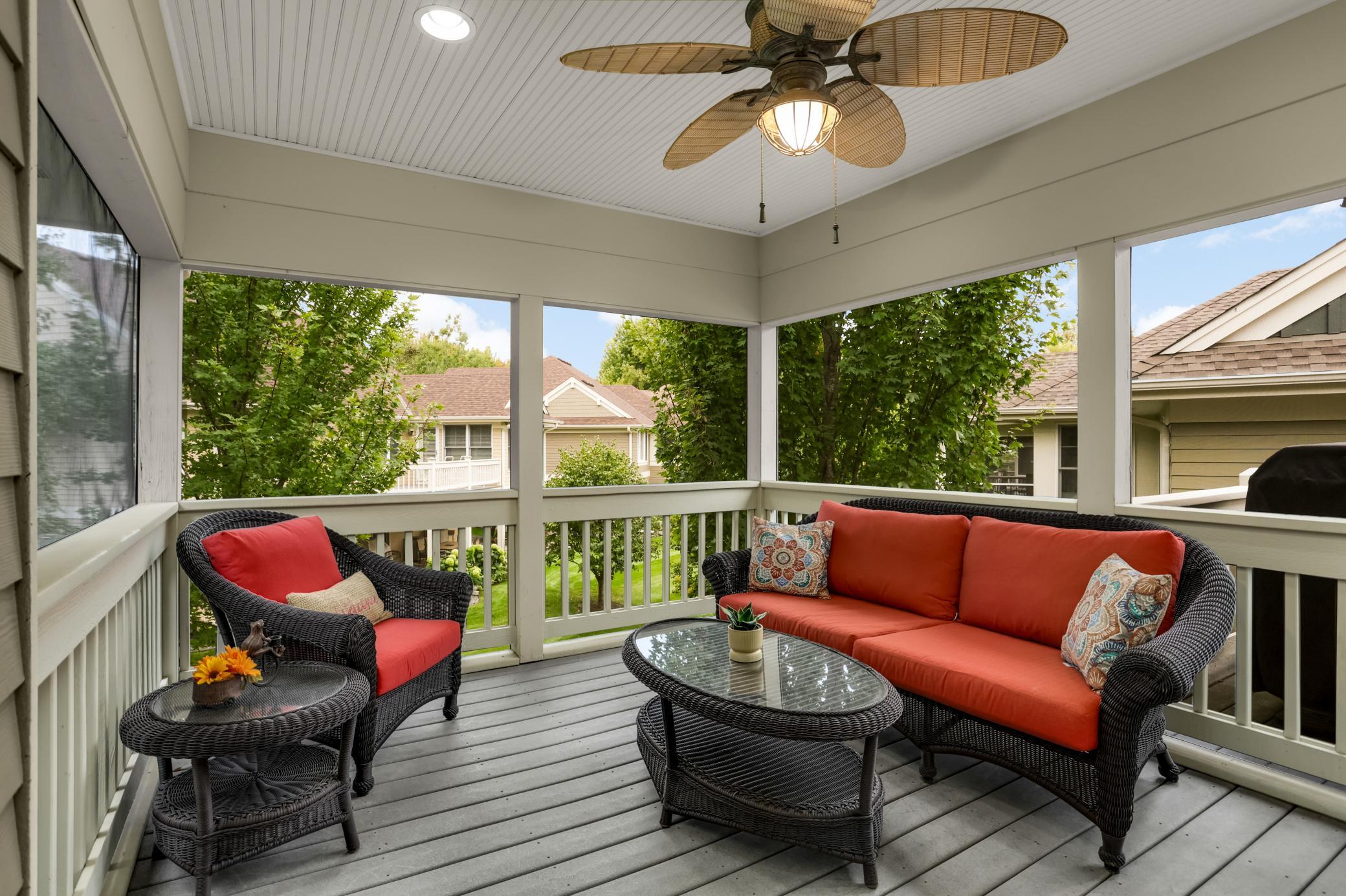 Beautiful screened-in rear porch with screening beneath the flooring, creating an inviting outdoor oasis with added protection from the elements and pests.