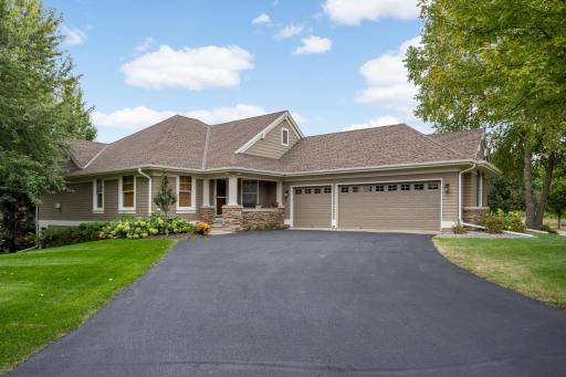 Beautiful detached home in highly sought after Dancing Waters, showcasing timeless curb appeal, exceptional craftsmanship, and a welcoming presence.