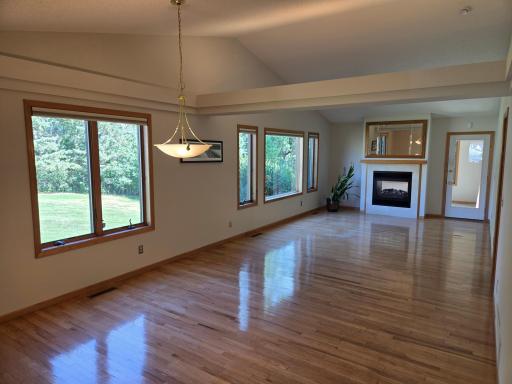 Spacious Living Room/Dining Room with beautiful wood floors vaulted ceilings and spectacular private views.