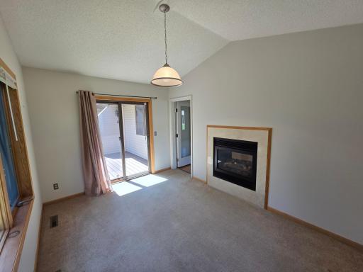 Sunroom backs up to the Living Room see thru Fireplace walks out to Deck with stairs to the wooded backyard!
