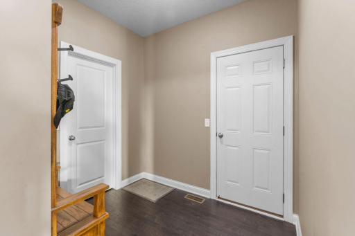 Mudroom entry from the 3-stall garage with closet
