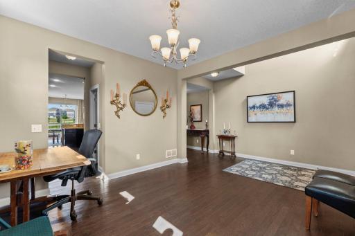 Formal dining with door to the kitchen and open to the front entry