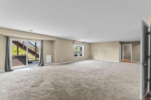 Walkout to the patio and hot tub, creating an ideal space for outdoor relaxation