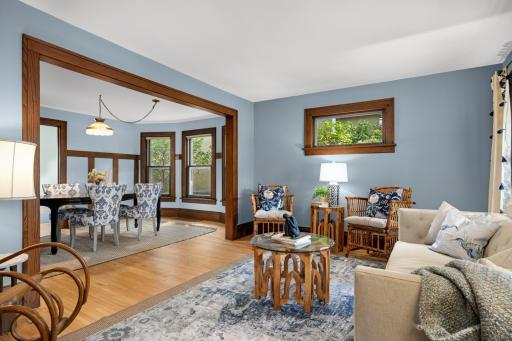 Living room and dining room are connected by the original archway.