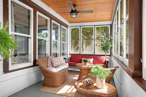 Quintessential inviting front porch with a gorgeous beadboard ceiling.