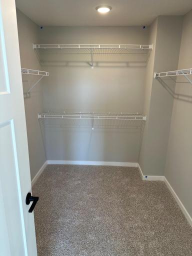 The first of two walk in closets in the primary in a similar Duncan end home